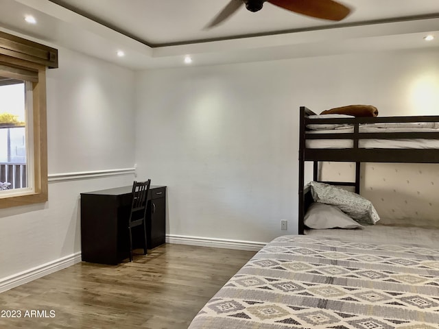 bedroom featuring ceiling fan and dark hardwood / wood-style flooring