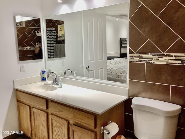 bathroom with vanity and toilet