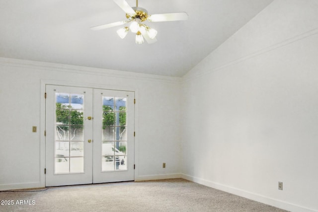spare room featuring ceiling fan, baseboards, lofted ceiling, light carpet, and french doors