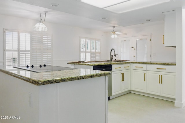 kitchen with black electric stovetop, dishwasher, a peninsula, white cabinets, and a sink