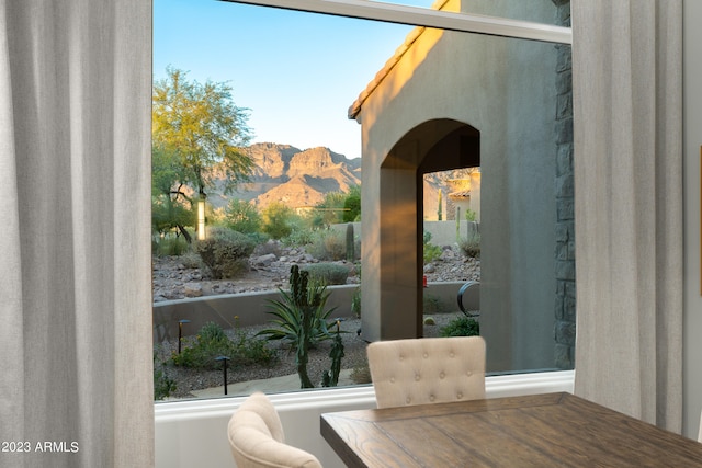 unfurnished dining area with a mountain view