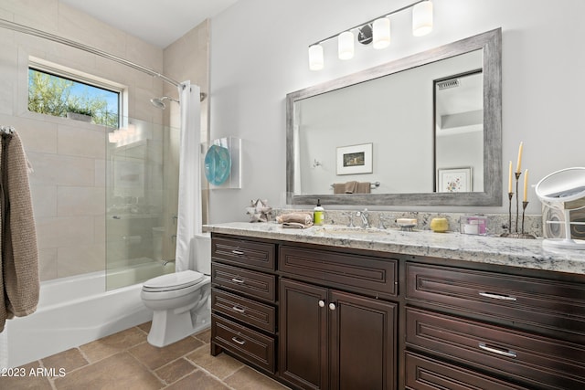 full bathroom featuring vanity, toilet, and tiled shower / bath