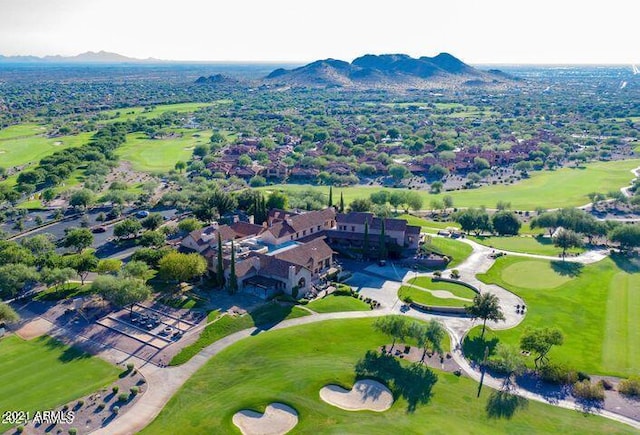 birds eye view of property with a mountain view