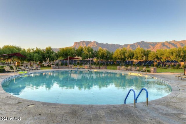 view of swimming pool featuring a mountain view