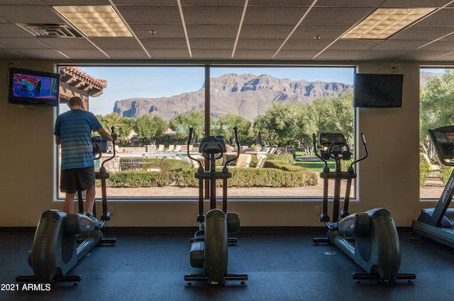 gym with a paneled ceiling