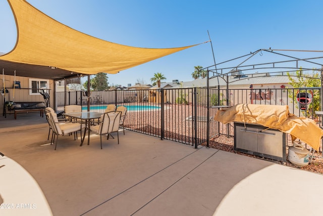 view of patio / terrace featuring a fenced in pool and fence