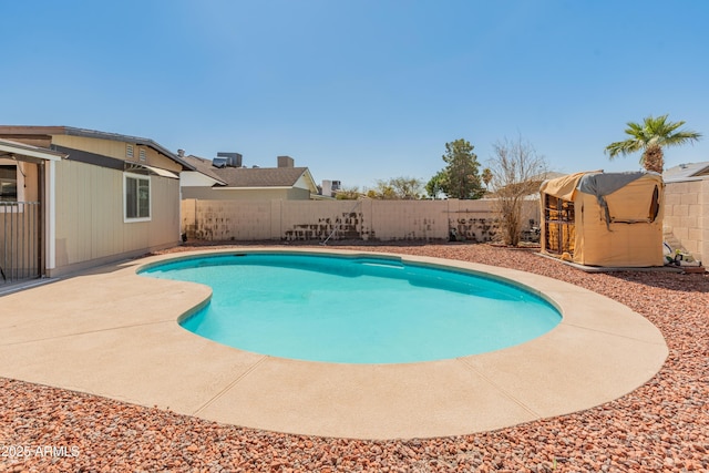 view of pool with a patio, a fenced backyard, and a fenced in pool