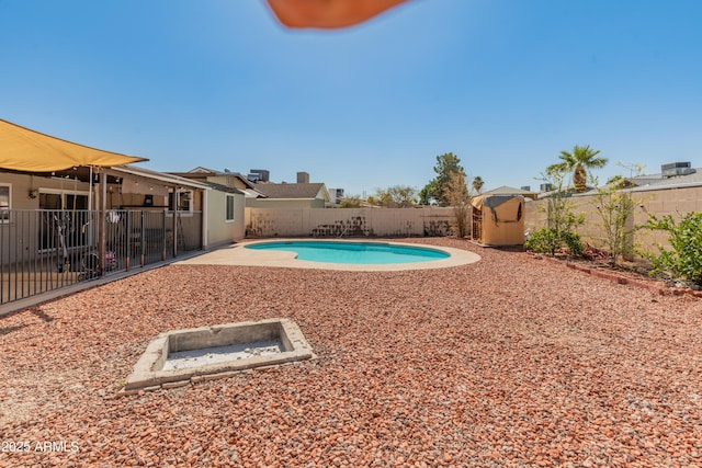 view of pool featuring a patio area, a fenced backyard, and a fenced in pool