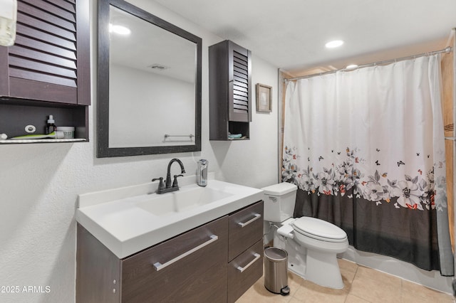 bathroom featuring visible vents, toilet, curtained shower, tile patterned flooring, and vanity