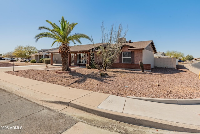 ranch-style house with brick siding