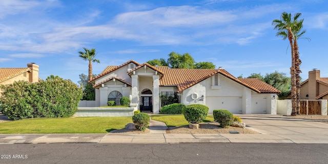 9821 E Windrose Dr, Scottsdale, AZ 85260 - mediterranean / spanish-style home with a garage, a tiled roof, and stucco siding