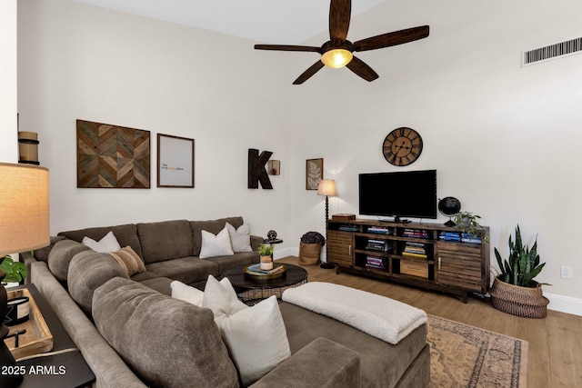 9821 E Windrose Dr, Scottsdale, AZ 85260 - living area featuring ceiling fan and wood finished floors