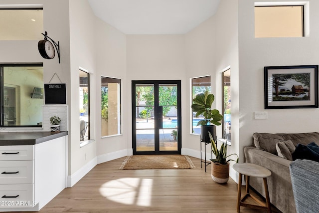 9821 E Windrose Dr, Scottsdale, AZ 85260 - entryway with a towering ceiling and light wood-style floors