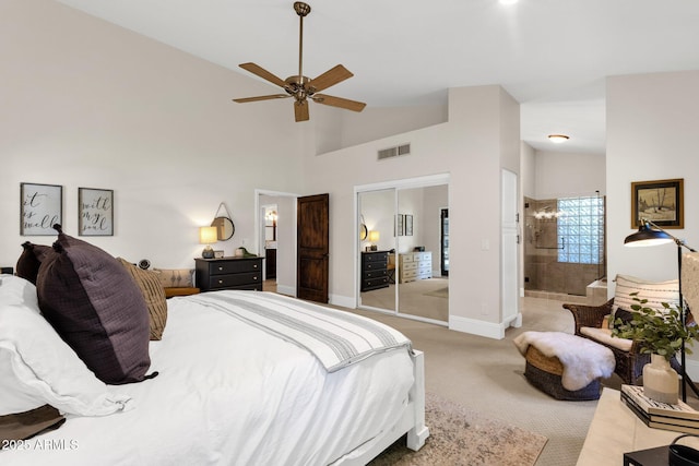 9821 E Windrose Dr, Scottsdale, AZ 85260 - bedroom featuring carpet, high vaulted ceiling, a ceiling fan, and a closet