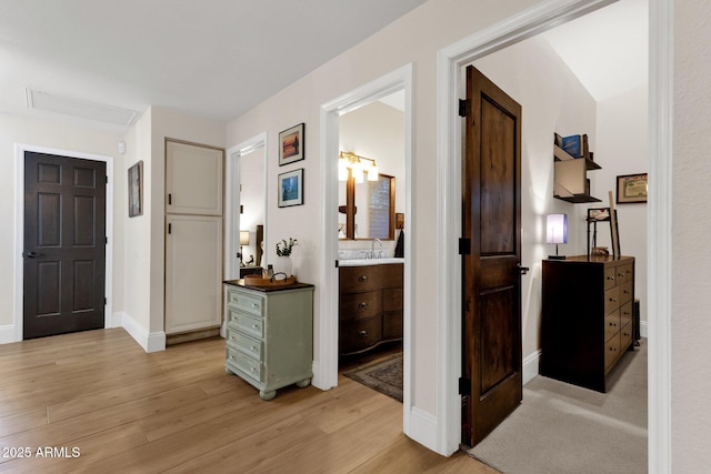 9821 E Windrose Dr, Scottsdale, AZ 85260 - corridor featuring light wood finished floors and baseboards