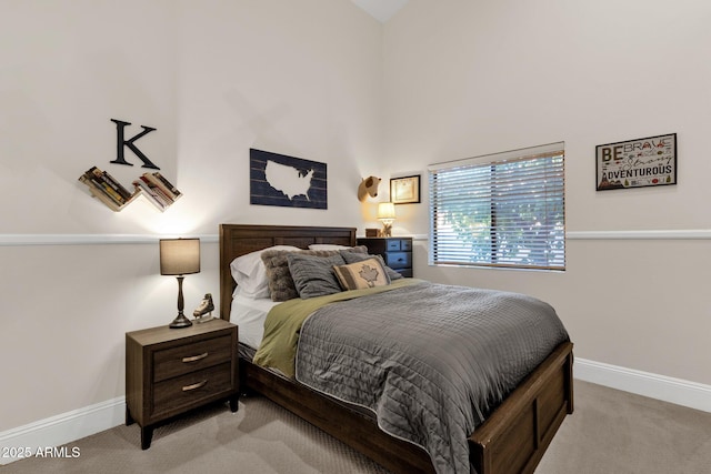 9821 E Windrose Dr, Scottsdale, AZ 85260 - bedroom featuring light carpet and a towering ceiling