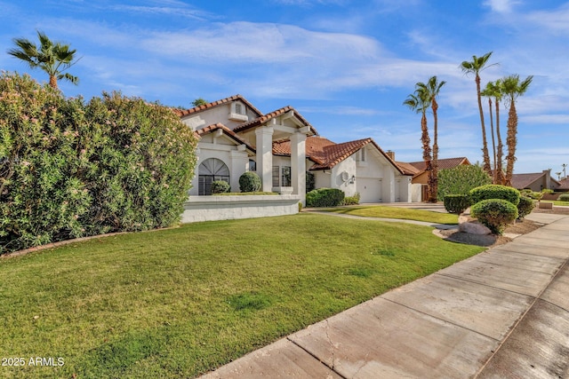 9821 E Windrose Dr, Scottsdale, AZ 85260 - mediterranean / spanish-style house featuring stucco siding, a tile roof, a front lawn, a garage, and concrete driveway
