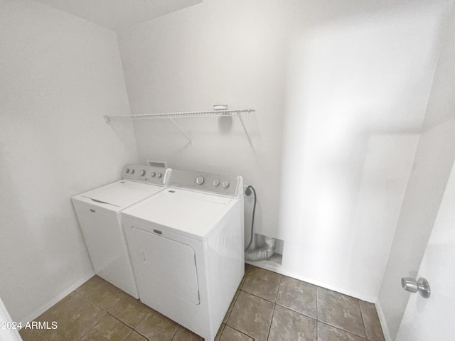 laundry room featuring washer and dryer and tile patterned floors