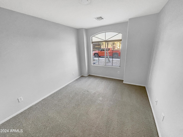 spare room featuring carpet flooring