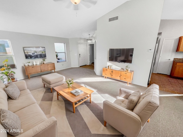 living room with light carpet, vaulted ceiling, and ceiling fan