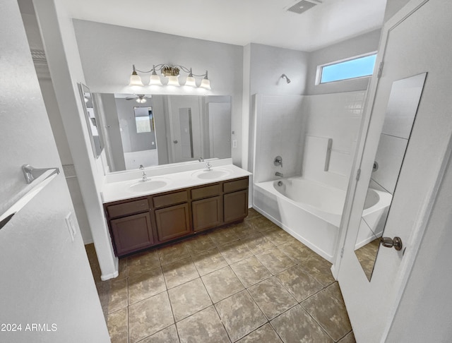 bathroom with tile patterned floors, vanity, ceiling fan, and bathtub / shower combination