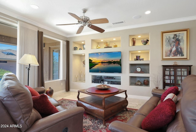 living room with ceiling fan, crown molding, and built in shelves