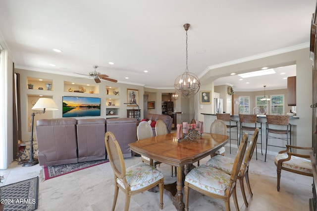 dining space featuring ornamental molding, ceiling fan with notable chandelier, light tile patterned floors, and built in shelves