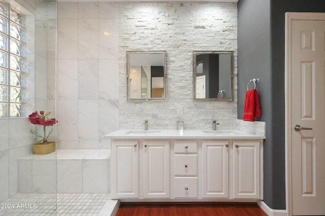 bathroom featuring backsplash, hardwood / wood-style flooring, and vanity