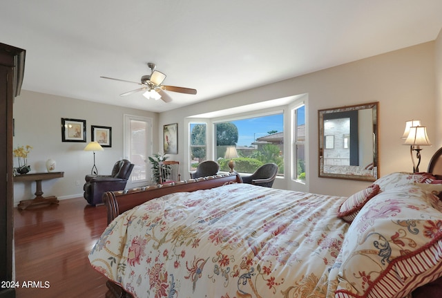 bedroom featuring ceiling fan and dark wood-type flooring