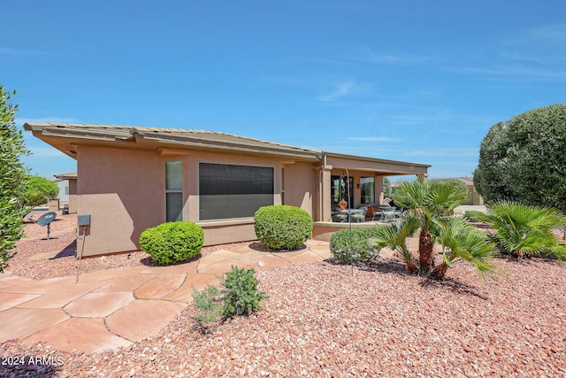 back of house featuring a patio area