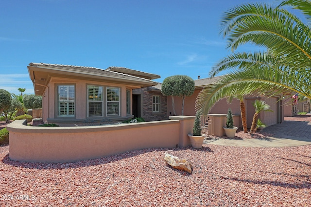 back of house with a garage