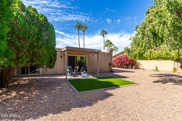 rear view of property with a patio