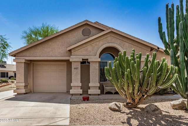 6621 S Coral Gable Dr, Chandler, AZ 85249 - view of front facade featuring stucco siding, an attached garage, and concrete driveway