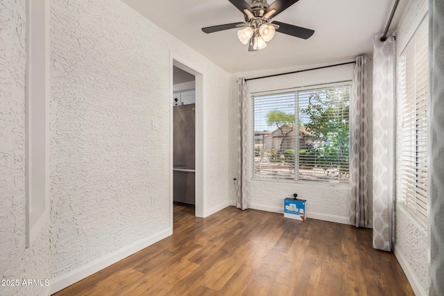 6621 S Coral Gable Dr, Chandler, AZ 85249 - unfurnished bedroom with freestanding refrigerator, baseboards, wood finished floors, a textured wall, and a ceiling fan