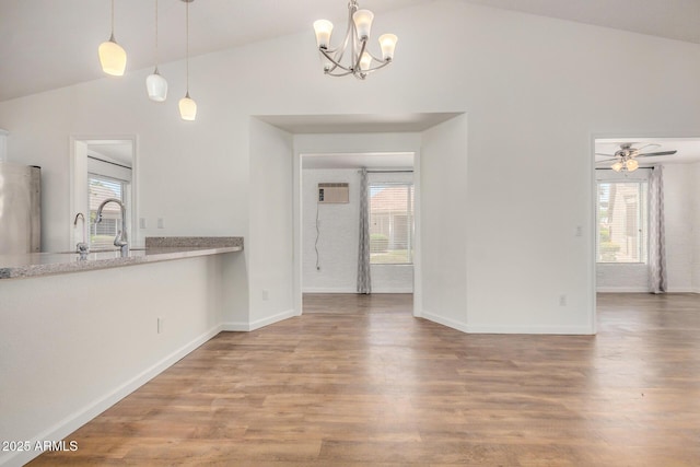 6621 S Coral Gable Dr, Chandler, AZ 85249 - unfurnished living room with healthy amount of natural light, wood finished floors, and high vaulted ceiling