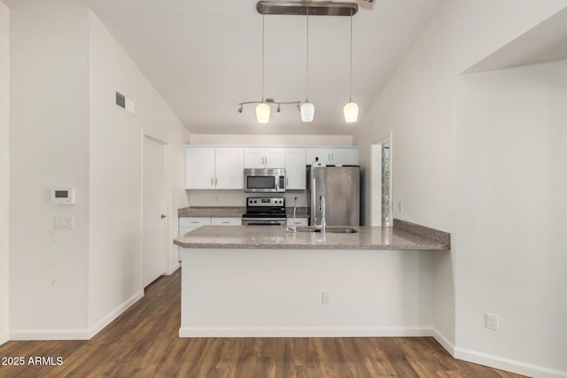 6621 S Coral Gable Dr, Chandler, AZ 85249 - kitchen featuring appliances with stainless steel finishes, a sink, a peninsula, white cabinets, and hanging light fixtures