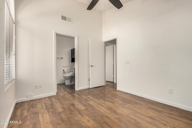 6621 S Coral Gable Dr, Chandler, AZ 85249 - unfurnished bedroom featuring a towering ceiling, wood finished floors, baseboards, ensuite bathroom, and ceiling fan