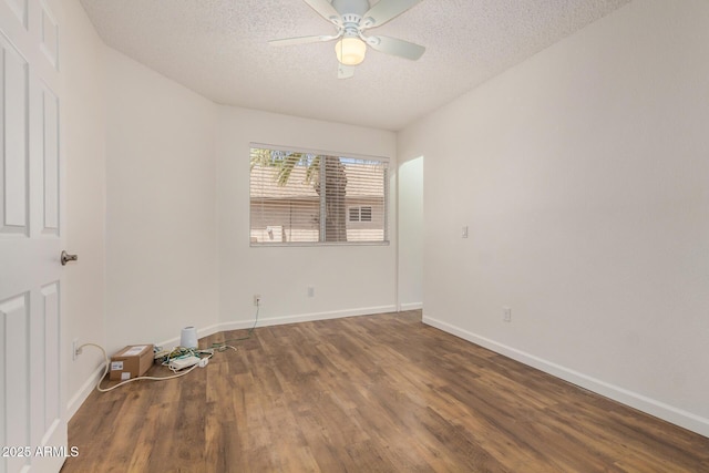 6621 S Coral Gable Dr, Chandler, AZ 85249 - unfurnished room featuring a textured ceiling, ceiling fan, wood finished floors, and baseboards