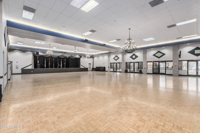 6621 S Coral Gable Dr, Chandler, AZ 85249 - misc room featuring a towering ceiling, a drop ceiling, and a chandelier