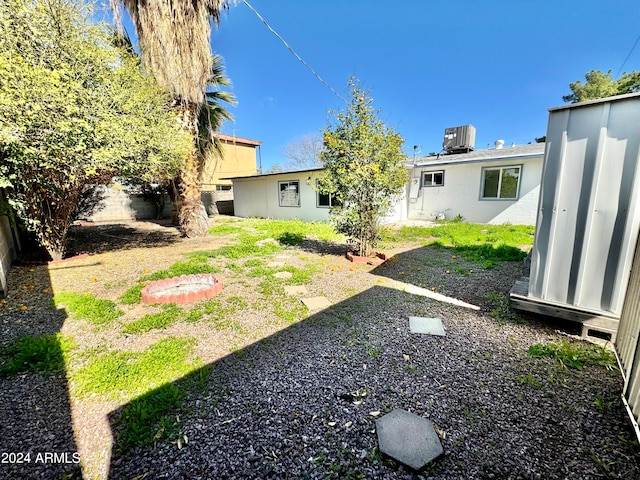 view of yard with central air condition unit