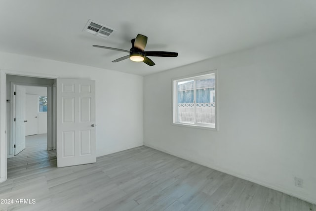 spare room with ceiling fan and light hardwood / wood-style floors