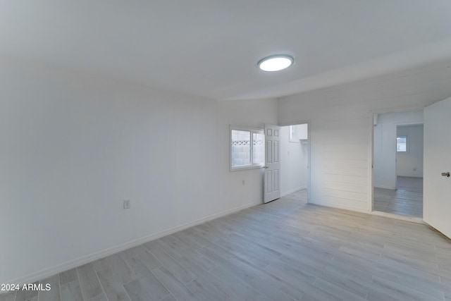 unfurnished room with light wood-type flooring