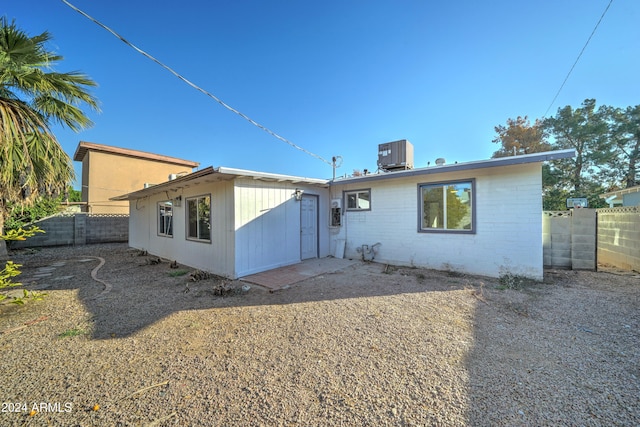 rear view of house with central AC