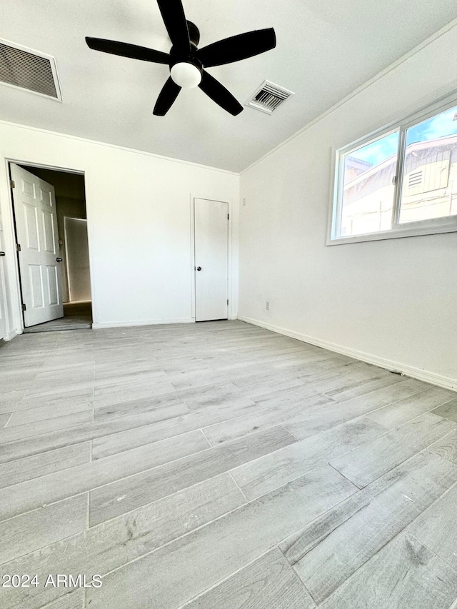 unfurnished bedroom featuring light hardwood / wood-style floors and ceiling fan