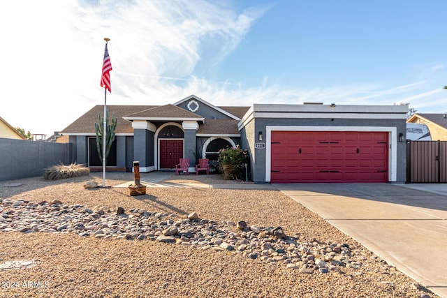 ranch-style house featuring a garage