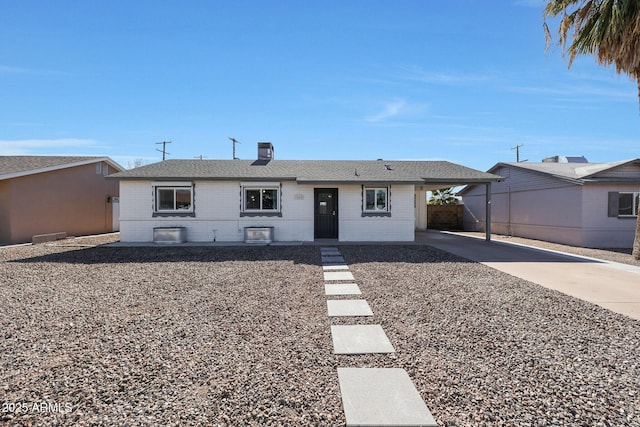 ranch-style home with a carport