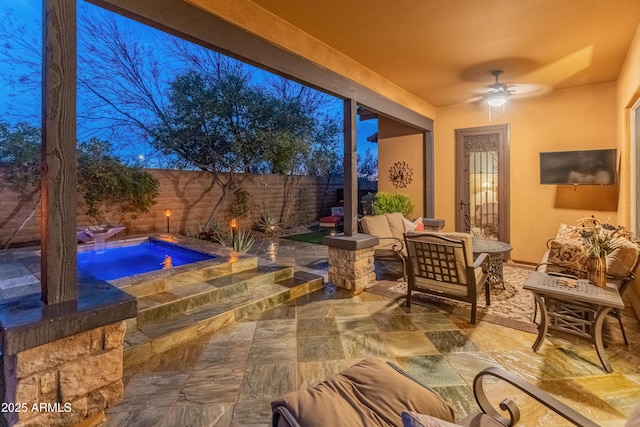 view of patio / terrace featuring an outdoor living space, a jacuzzi, and ceiling fan