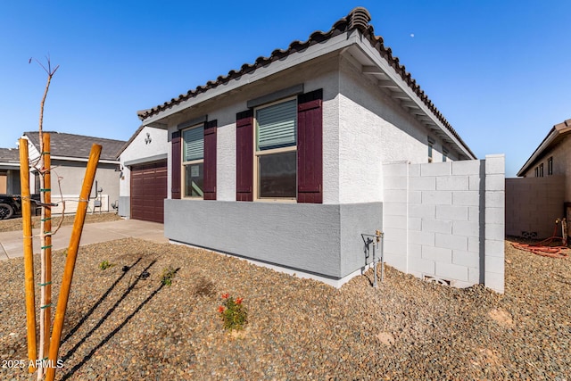 view of property exterior with a garage