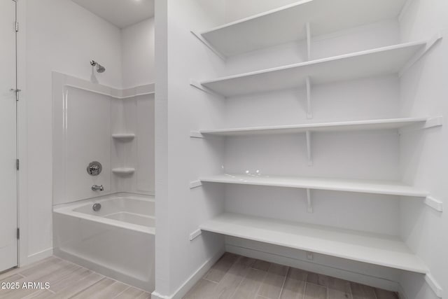 bathroom featuring shower / washtub combination