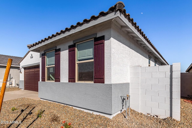 view of property exterior with a garage